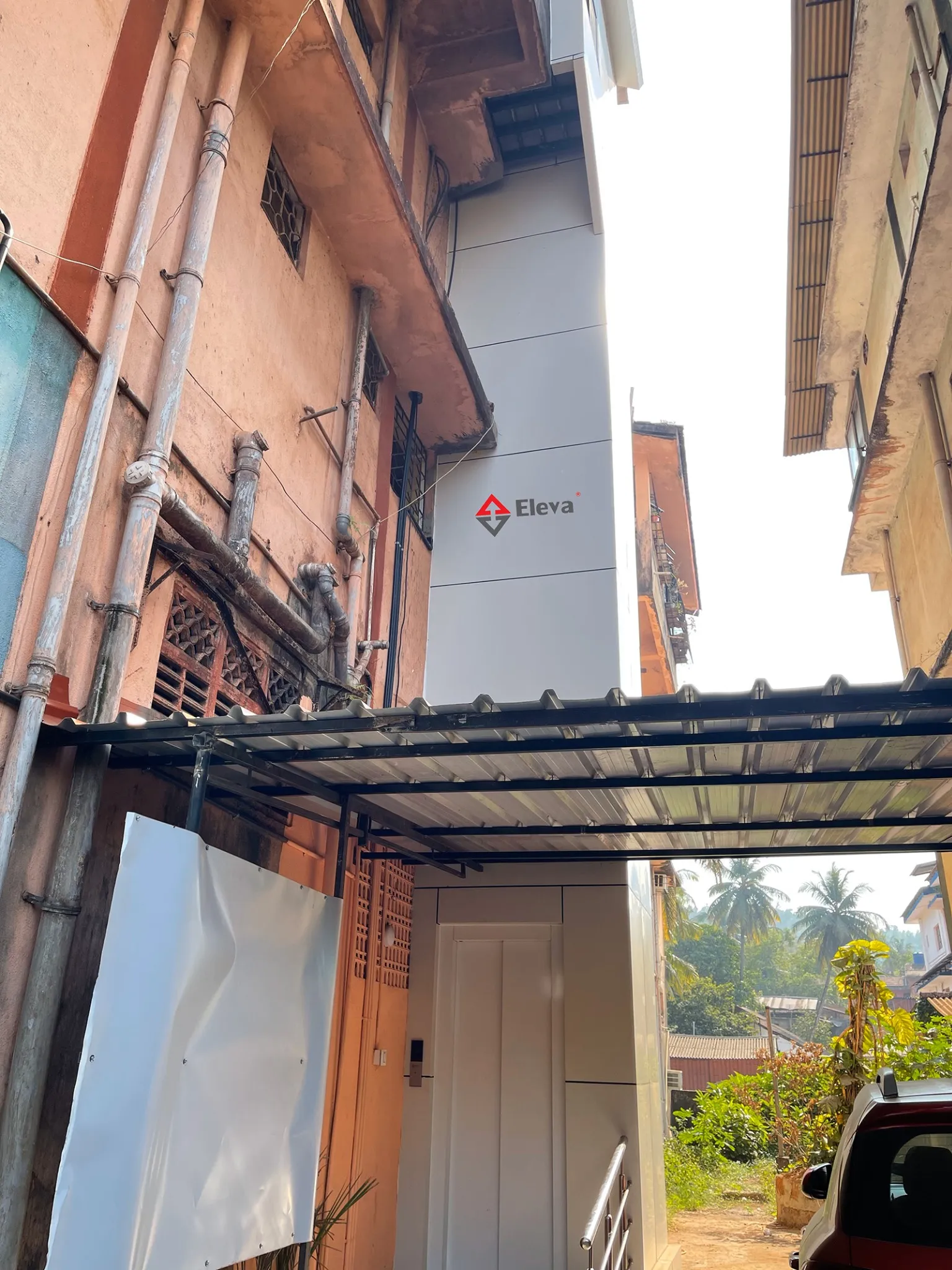 External passenger elevator installed for an existing society building in Bicholim, Goa
